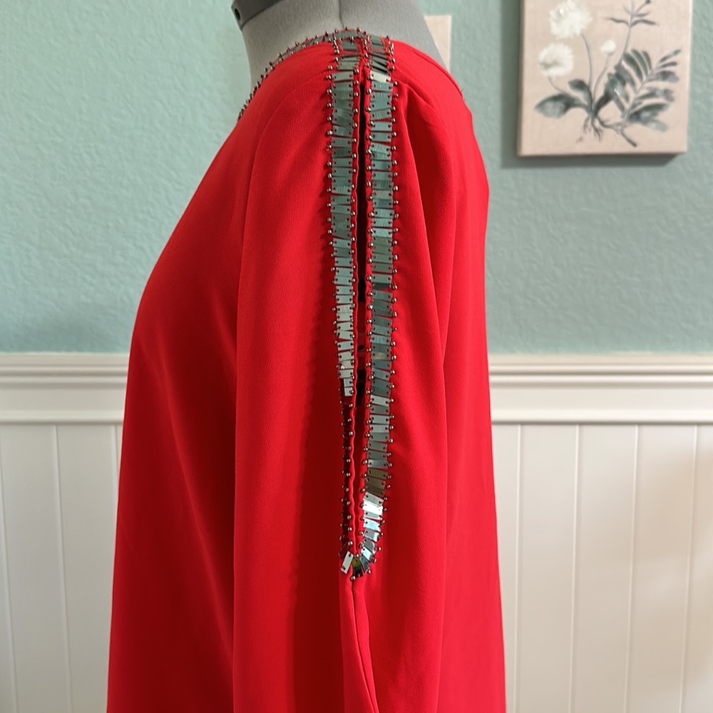Gorgeous red top with silver detail and open arms